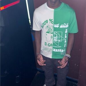 CHNGE CHNGE split-color graphic t-shirt.